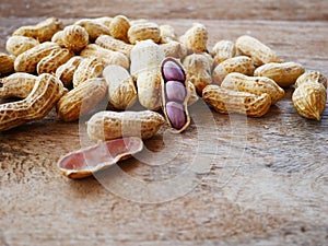 Peanut open shell on group of peanuts close shell