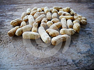 Peanut open shell on group of peanuts close shell
