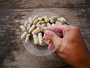 Peanut open shell on group of peanuts close shell