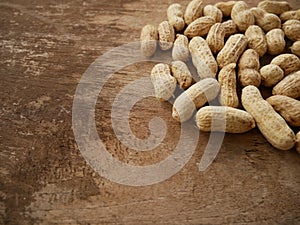 Peanut open shell on group of peanuts close shell