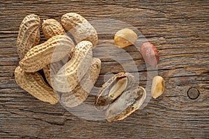 Peanut in a shell on wooden background. Food background. Top view