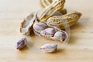 Peanut in shells and wooden background close up Boiled peanuts