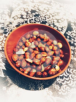 Peanut snack in wooden bowl.