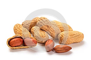 Peanuts isolated on white background, macro photography. Whole nuts and shelled kernels