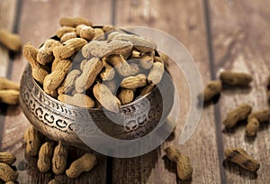 Peanuts in a metal bowl