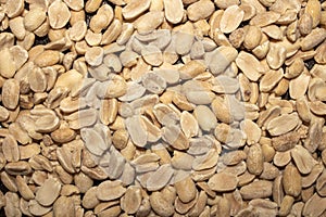 The peanuts are raw and peeled.Peanuts are split.Nuts are peanuts background