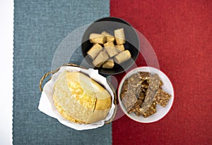 Peanuts in the shape of sweets, pacoca, cornmeal cake and peanut butter on bread