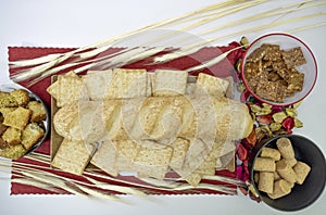 Peanuts in the shape of sweets, pacoca, cornmeal cake and peanut butter on bread