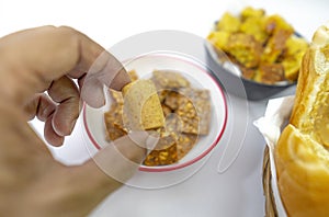 Peanuts in the shape of sweets, pacoca, cornmeal cake and peanut butter on bread