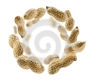 Peanuts in the shell levitate on a white background