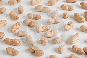 Peanuts in shell on a white background. Top view. Copy, empty space for text