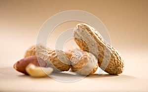 Peanuts. Unshelled nuts close up. Roasted pile of peanuts in shell. Organic vegan, vegetarian food