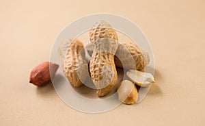 Peanuts. Unshelled nuts close up. Roasted pile of peanuts in shell. Organic vegan, vegetarian food