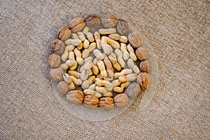 Peanuts and walnuts arranged to form a round. photo