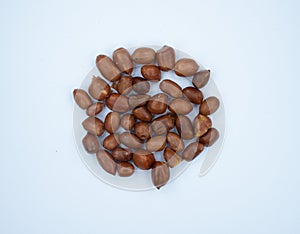 Peanuts on white background - fired peanuts