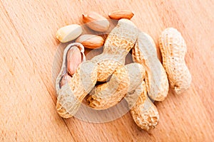 Peanuts on wooden board