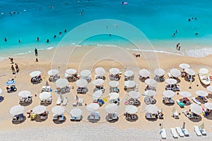 Peaople resting on the beach, umbrella rows, Kaputash, Turkey