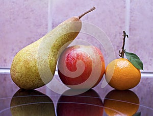 Pear, apple and tangerine still life