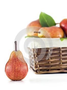 Pear with a basket in the background