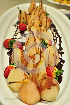Pear with chocolate and strawberries