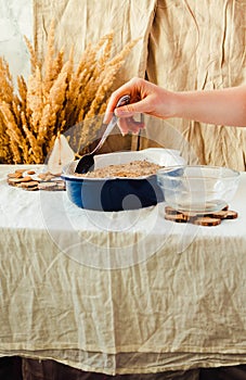 Pear crumble cake in blue baking dish. Linen tablecloth autumn c