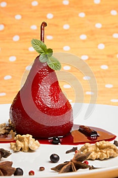 Pear flavored with red wine with Brachetto syrup and crunch nuts