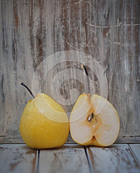 Pear fruit isolated on wooden background