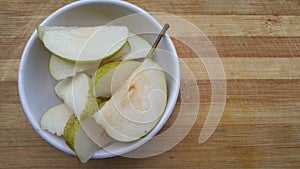 Pear fruit slices in bowl