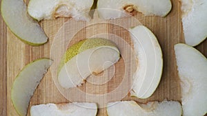 Pear fruit slices on wooden background