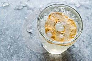 Pear Juice Cocktail with Dried Pear Slice and Crushed Ice.