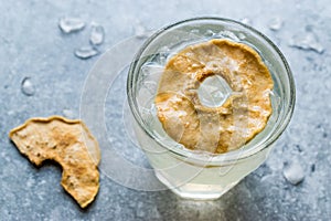 Pear Juice Cocktail with Dried Pear Slice and Crushed Ice.