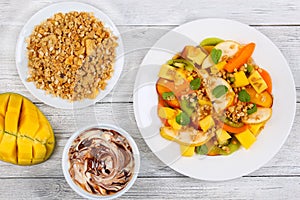 Pear, kiwi, apricot,mango salad with muesli