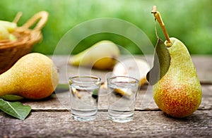 Pear with leaf and shot glass