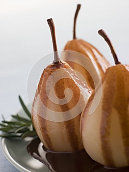 Pear Poached with Rosemary and a Chocolate sauce