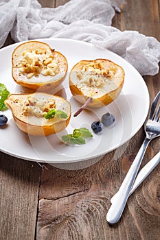 Pear with ricotta cheese, honey and cinnamon photo