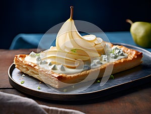 Pear tart. Home made pear and blue cheese cake with half poached pear slices. Tasty gourmet dish, healthy eating concept. Square