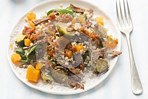 Pearl barley and beef salad with pickled pumpkin and brussel sprouts and red pepper dressing