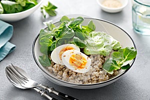 Pearl barley bowl with soft-boiled egg and corn salad