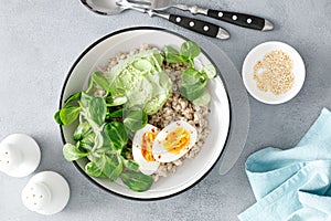 Pearl barley bowl with soft-boiled egg and corn salad