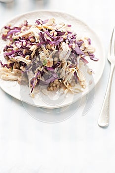 Pearl barley salad with roasted chicken pieces, red cabbage and lemon dressing