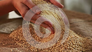 Pearl barley spilling on burlap