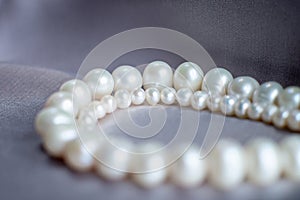 Pearl beads, luxury pendant, necklace closeup.