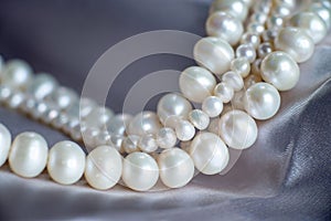 Pearl beads, luxury pendant, necklace closeup.