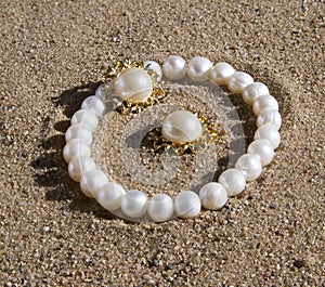 Pearl bracelet and earrings lying