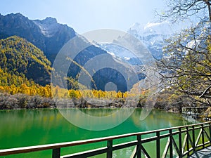 Pearl Lake or Zhuoma La Lake and snow mountain in autumn