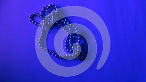 Pearl Necklace below blue neon light. It represents vanity, luxury, wealth, trend, fashion. With space for text