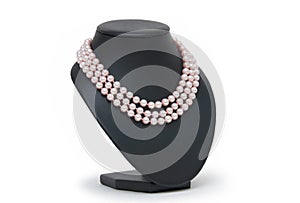 Pearl necklace on black mannequin isolated