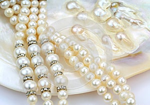 Pearl necklace with natural pearls in a oyster shell