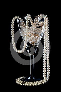 Pearl ornament in a glass wine glass