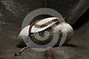A pearl placed on a stone